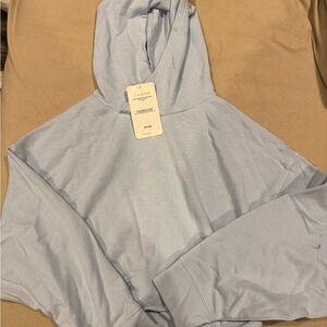 Fabletics Brisa Cropped Raw Edge Hoodie in Soft Blue